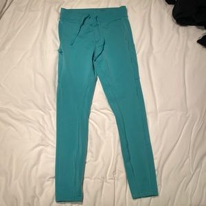 Alo turquoise tights with pockets